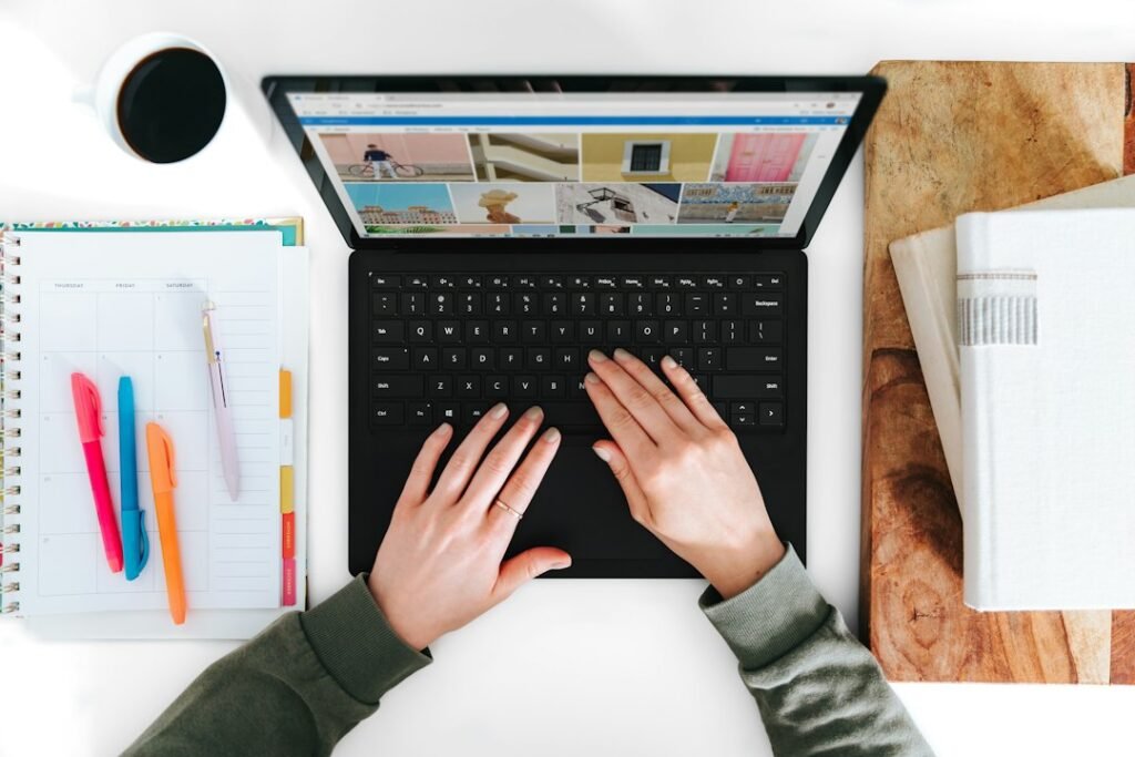 Laptop and study materials for planning an online learning platform