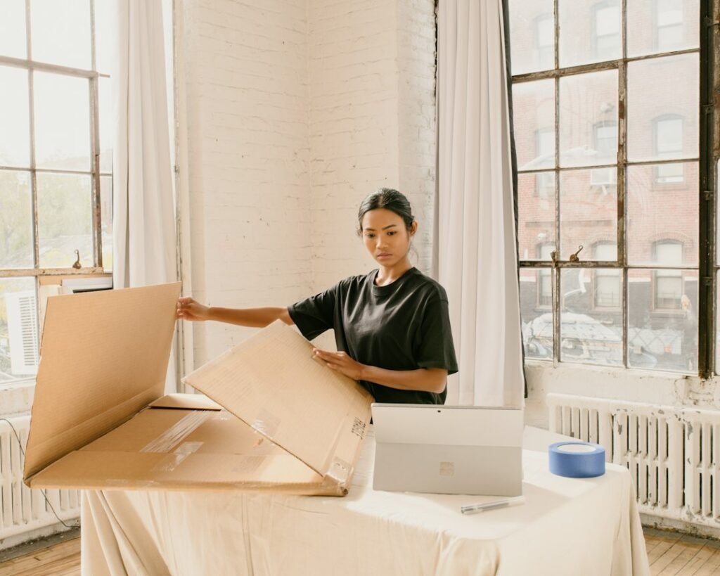 Small business owner preparing a package for an online store order