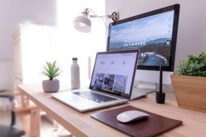 Laptop and desk setup for reviewing a website redesign